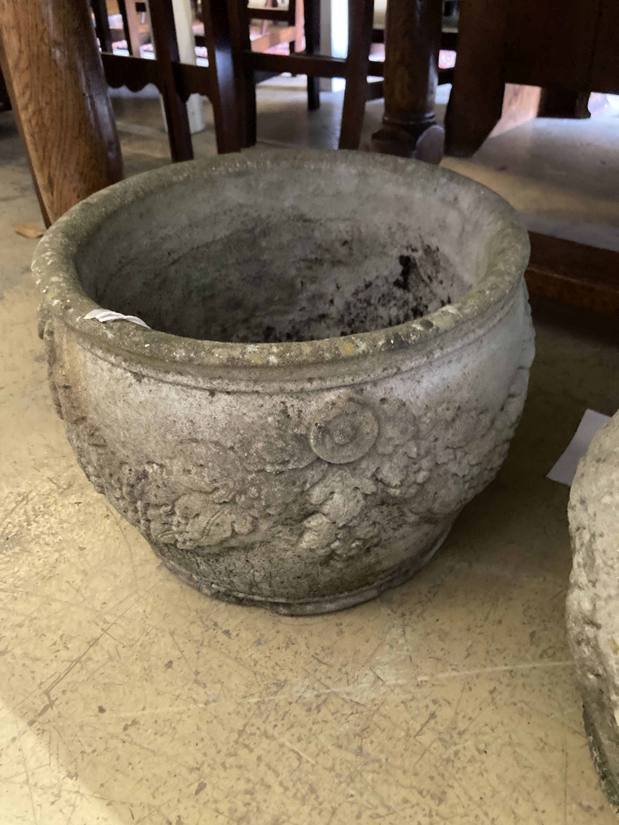 A pair of reconstituted stone circular garden planters, diameter 36cm, height 26cm